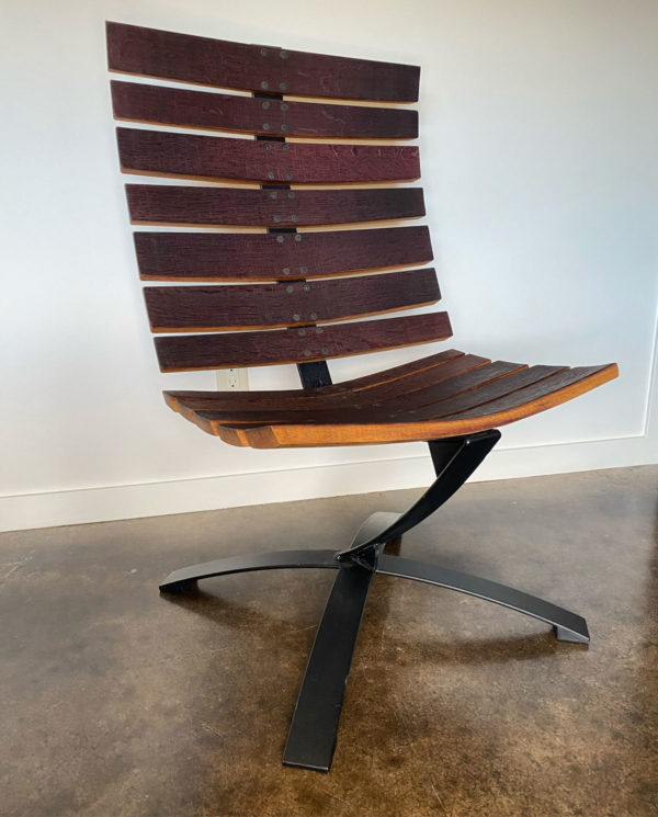 Lounge chair made with recycled leaf springs and wine barrel staves