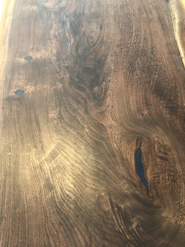 One of a kind live edge black walnut waterfall coffee table with black metal leg