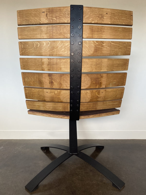 Lounge chair made with recycled leaf springs and wine barrel staves