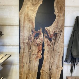 Epoxy river door with maple slabs and black epoxy