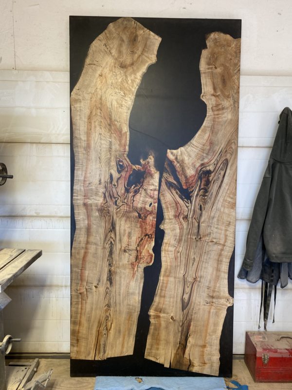 Epoxy river door with maple slabs and black epoxy