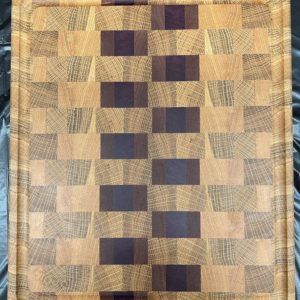 End grain cutting board with brick pattern