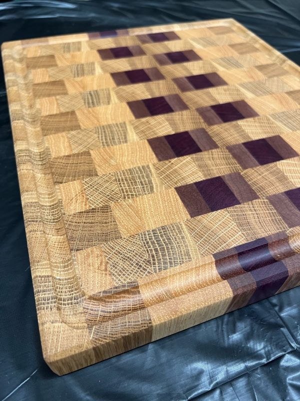 End grain cutting board with brick pattern